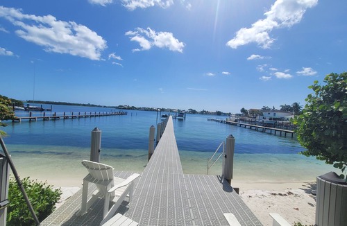 Boynton Beach Villa | Waterfront oasis w/white sand beach, pool & dock minutes to Delray & Palm Beach!