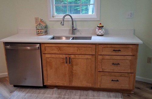 Palmyra House | Whispering Pines is a lovely 3-bedroom family-friendly home in a wooded setting.
