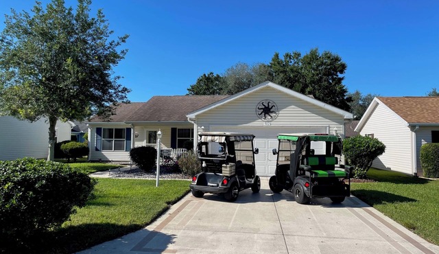 Cozy home w/golf cart, lanai, smart TVs, & prime location near town squares!