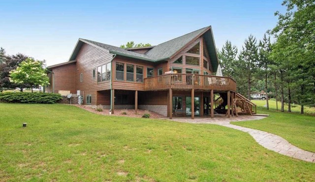 Dog-friendly lakefront getaway with dock, firepit, wet bar, game room, & AC