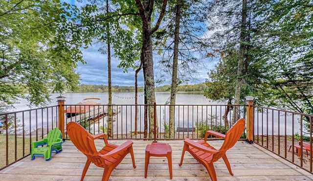 Dog-friendly lakefront home with a private beach, dock, firepit, & kayaks
