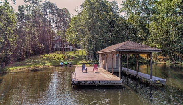 Lakefront home with boat dock, private firepit & game room - dog-friendly