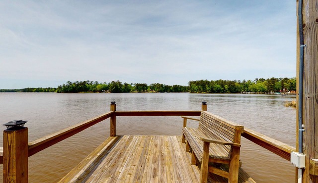 Lakefront home with incredible sunset view, private dock, screened porch, and AC