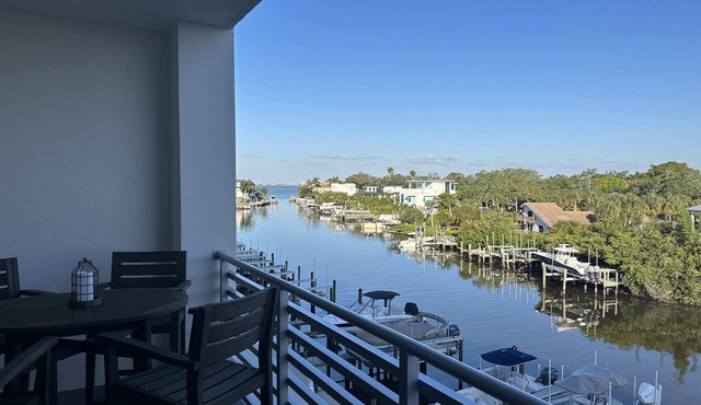 Luxury 2 Bed 2 Bath Waterfront Condo with Patio Sunsets Gym and Parking