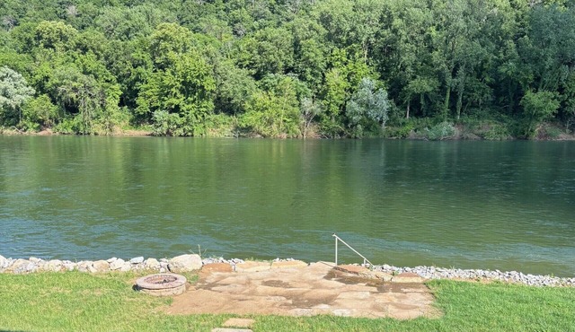 Private riverfront getaway with direct steps to fishing paradise.