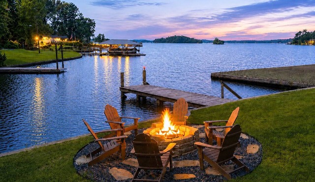 Relax at this updated Lake Martin retreat with a private dock, spacious deck, firepit seating, covered patio, and bright open living spaces—perfect for lake days, family getaways, and Auburn weekends.