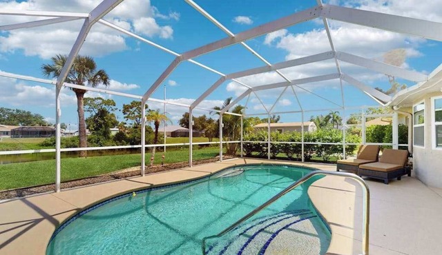 Snowbird-friendly home with private pool, water views, patio & sunroom