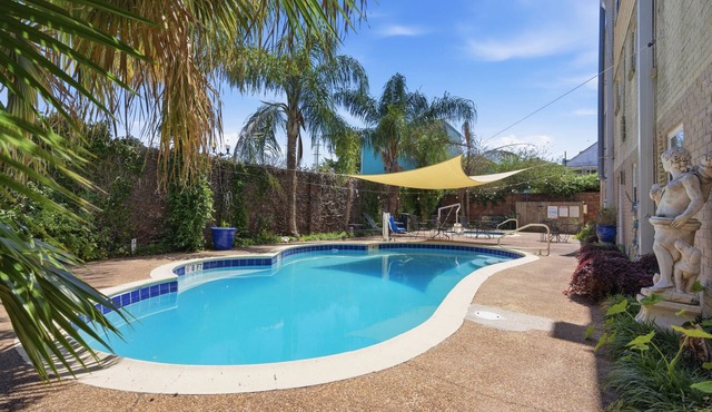 Spacious 8BR Frenchmen Street stay with pool, hot tub, parking, and easy access to the French Quarter and live music.