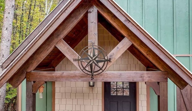 Welcome to the Compass Lodge with HotTub! Sit back and relax in this calm, stylish space.